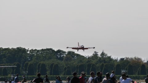 Rivolto del Friuli Italy SEPTEMBER, 17, 2021 Military jet airplane lands during an airshow with crowd watching it. Aermacchi MB-326 by Volafenice