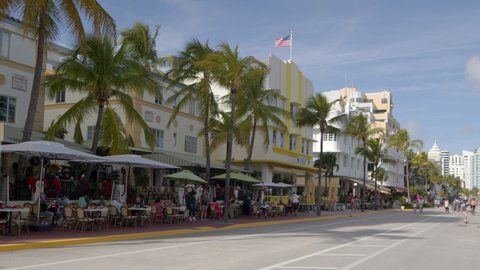 Miami Beach, FL, USA - December 17, 2021: 6k video tourists dining on Ocean Drive art deco district Miami Beach