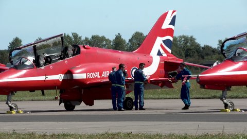 Gdynia , Poland - 08 22 2021: Red arrows Royal Air Force Aerobatic Team Pilots waiting outdoors on runway during sunny day - Gdynia Aerobaltic in Poland