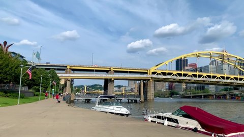 Pittsburgh , Pennsylvania , United States - 08 21 2021: Panoramic view of Andy Warhol Bridge seen from the Allegheny river waterfront with the Pittsburgh downtown in the background during summer