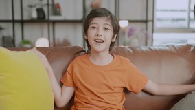 happiness asian male child boy pov shot speak to camera pretent video calling to his family using smartphone device telecommunication,Small kid in speak talk on video call, study distant. Online call