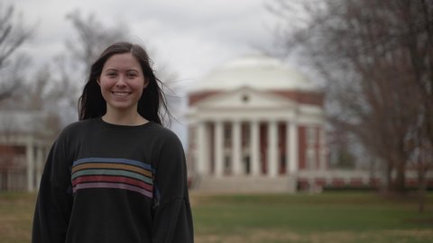 Portrait of a young teen female student at a university or college in Charlottesville, VA in front of the rotunda designed by Thomas Jefferson.