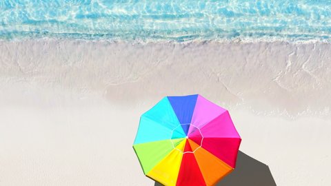 LGBT Concept: Aerial view of Tropical Beach with colorful umbrella of lgbt colors, LGBT women on Vacation at the beach,  Love and relationship concept colored bright umbrella umbrella on the coastline