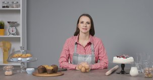 Woman teaching how to prepare delicious desserts in her kitchen, online cooking classes and courses concept