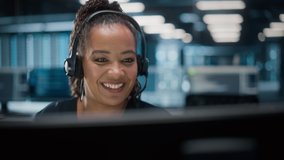 Call Center Office: Portrait of Friendly African American Female Technical Customer Support Specialist Talking on a Headset, uses Computer. Client Experience Officer Helps Online via Video Conference - Powered by Shutterstock - Get 15% off with code: PIKWIZARD15