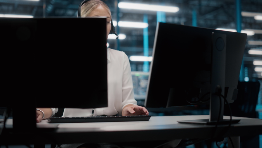 Call Center Office: Portrait of Friendly Caucasian Female Technical Customer Support Specialist Talking on a Headset, uses Computer. Client Experience Officer Helps Online via Video Conference Royalty-Free Stock Footage #1084218208