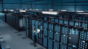 Animated Concept: Big Data Center Female Chief Technology Officer Using Laptop Standing In Warehouse, Activates Servers, Information Digitalization Starts. SAAS, Cloud Computing, Web Service - Powered by Shutterstock - Get 15% off with code: PIKWIZARD15