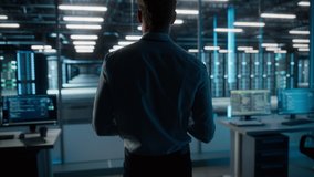 Big Data Center Specialist Engineer Using Laptop Computer. Server Farm Cloud Computing Facility with System Administrator Working. Software as Solution and Cloud Computing with Cyber Security - Powered by Shutterstock - Get 15% off with code: PIKWIZARD15