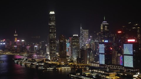 Hong Kong, China, Asia - Nov 2021: Drone Night Shot Panorama View of Hong Kong City Skyline Central Business District