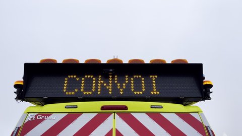 Vendenheim, France - Circa 2021: Gruau French emergency car with Ralentir signage text on the led panel board translated as slow down seen on the highway in France