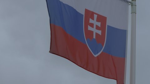 Ungraded: National flag of Slovakia on the flagpole. Slovak official flag waving in the wind. Ungraded H.264 from camera without re-encoding.