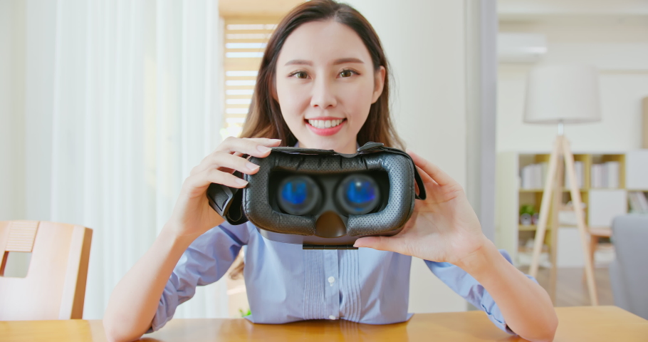 asian woamn holds metaverse glasses and takes closer to camera Royalty-Free Stock Footage #1084241629