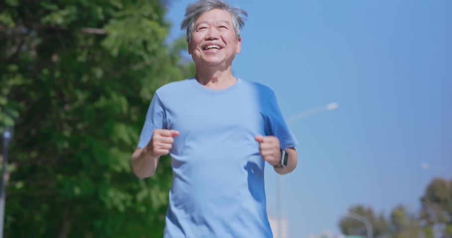 slow motion of asian elderly man running happily outdoor Royalty-Free Stock Footage #1084241683