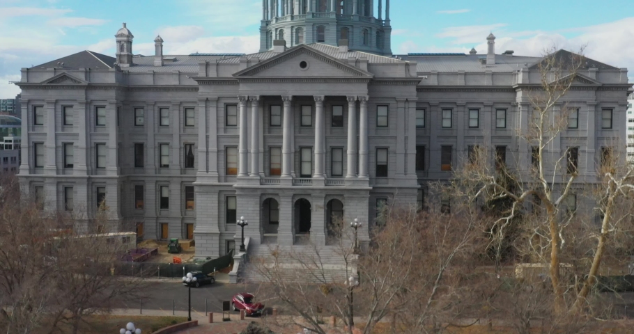 Colorado state capitol with Denver skyline droneing up close up.