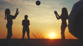 people in the park. friendly family silhouette playing in the park on vacation in a car trip. happy family outdoor travel concept. family on vacation playing ball next to the car in nature sunlight - Powered by Shutterstock - Get 15% off with code: PIKWIZARD15