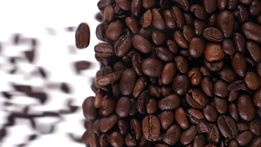 coffee beans fall in slow motion and cover the whole screen, vertical video Royalty-Free Stock Footage #1084251685