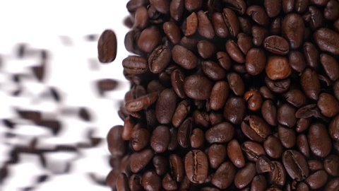 coffee beans fall in slow motion and cover the whole screen, vertical video