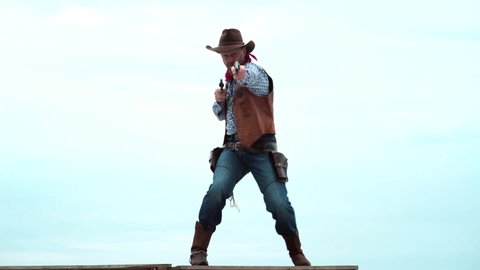 Sheriff in cowboy hat. Man with wild west guns, vintage pistol revolver and marshal ammunition. American gunslinger on wild west, guy shooting with gun revolver weapon.