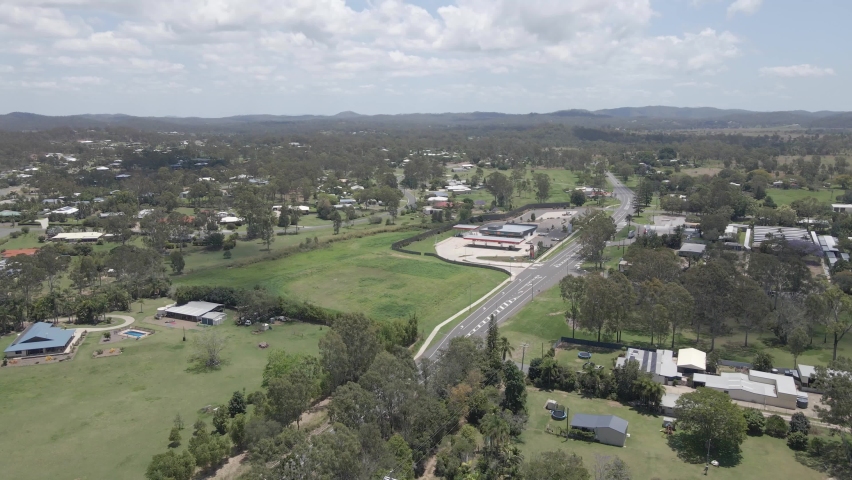 Benaraby Landscape With Houses And Trees On A Sunny Day In Far North Queensland, Australia. aerial sideways