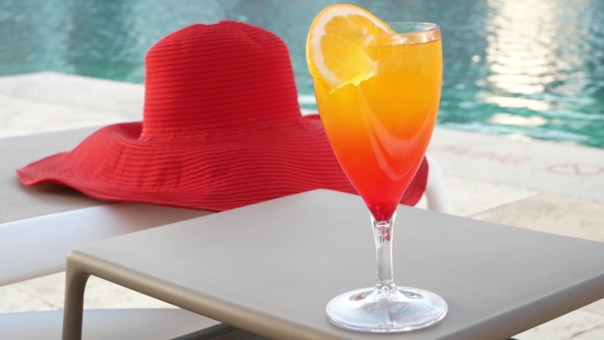 Sex on the beach Cocktail near the swimming pool. Delicious beverages. Holiday and relaxtion concept, closeup