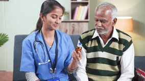 Happy smiling nurse or doctor advising or recommending senior patient to take medicines during home health checkup - concept routine Healthcare, caring and medical service or treatment. - Powered by Shutterstock - Get 15% off with code: PIKWIZARD15