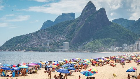 Rio de Janeiro, Brazil - December 9, 2021: Zoom out time lapse view of famous Ipanema beach during summer in Rio de Janeiro, Brazil. 