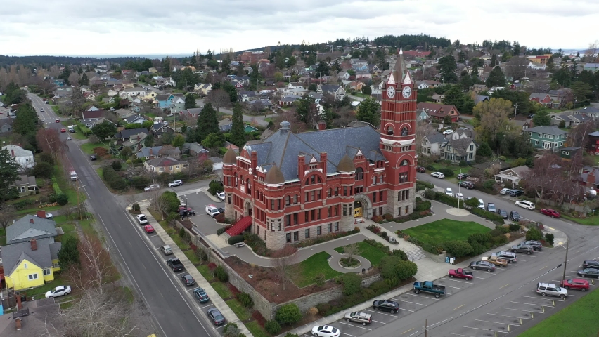 Cinematic 4K aerial drone 360 orbit footage of the Jefferson County Courthouse in Port Townsend, with Uptown and School Hill in Washington state