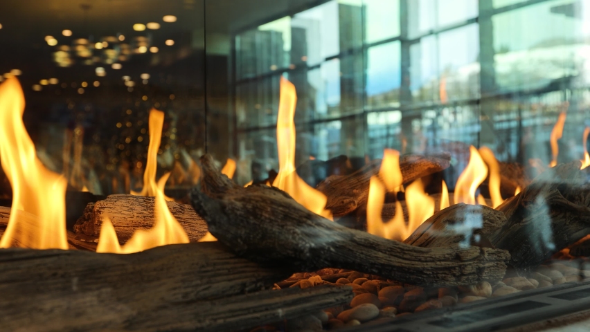 Flames from Gas Fireplace in Fancy Glass Display - Closeup Royalty-Free Stock Footage #1084274803