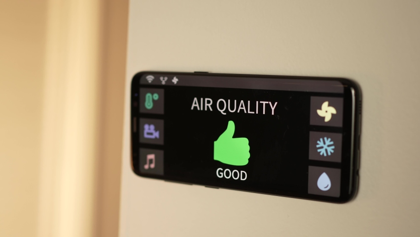 Smart home with an air quality sensor showing that the air is good on a digital screen. Royalty-Free Stock Footage #1084276756