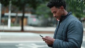 Person walking in city looking at smartphone. checking cellphone in urban sidewalk - Powered by Shutterstock - Get 15% off with code: PIKWIZARD15