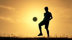 Boy with soccer ball. Child in park plays at sunset.Boy juggles soccer ball.Child dream of football match.Sports training in park. Sportsman is in control of ball. Child juggles ball.Healthy lifestyle - Powered by Shutterstock - Get 15% off with code: PIKWIZARD15