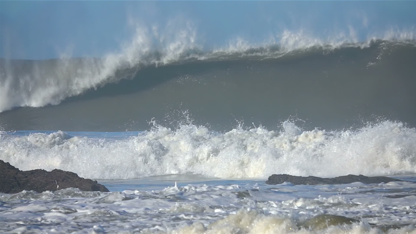 Extreme Ocean Wave crushing coast. Power of waves breaking splashing sea-spray water foam Royalty-Free Stock Footage #1084283404