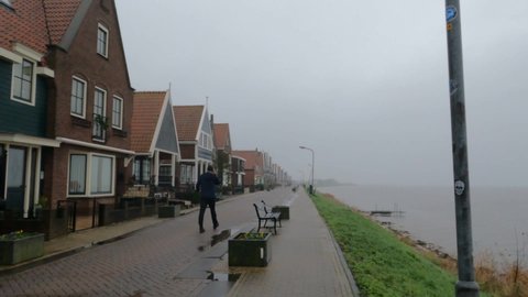 Volendam Holland Netherlands on December 12, 2021 houses next to the sea in the fishing village