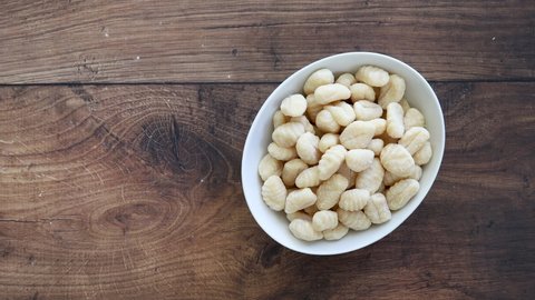 Serving a Bowl of Raw Gnocchi with Room for Copy