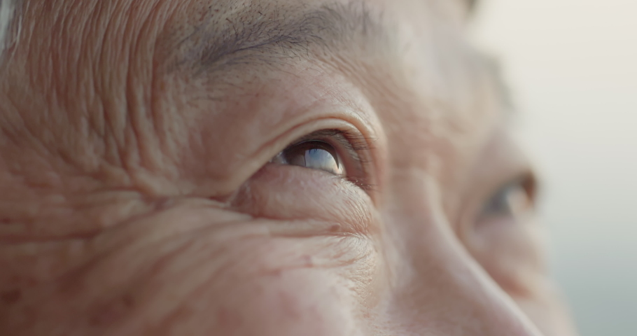 Slow motion close up shot of asian old man eye | Shutterstock HD Video #1084294717