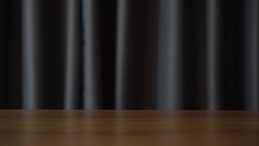 Man open white curtains at room.