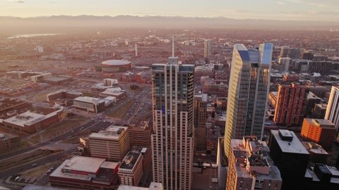 Four Seasons Hotel Denver, Downtown Denver Colorado. Drone Aerial View Flying Around 5-Star Luxury High Rise Building During Golden Hour Sunset.