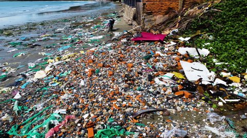 Hon Rom beach in Mui Ne, Vietnam. Plastic pollution and waste cover the shore