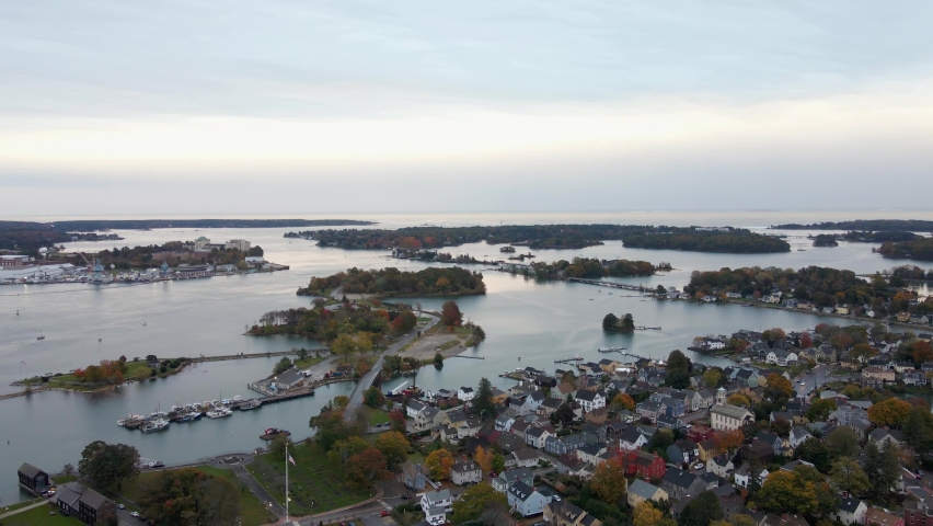 Aerial view of islands and the cityscape of Portsmouth, in New Hampshire, USA - reverse, drone shot