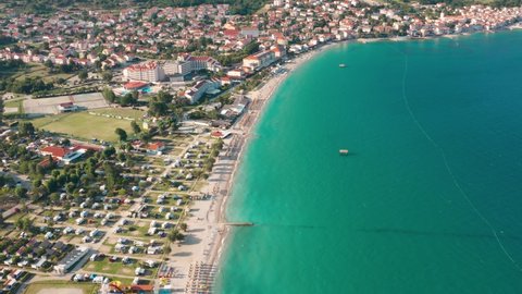 Flyover shot of the coastline of a city on Krk Island, Croatia.