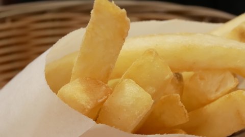 Close up of fries at food court area inside a shopping mall with 4k resolution