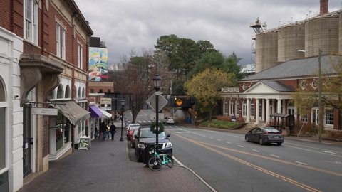 Charlottesville, VA, USA - 12 11 2021: Students and teachers shopping across the street from UVA, University of Virginia in Charlottesville, VA on overcast day.