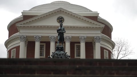 Charlottesville, VA, USA - 12 11 2021: Statue of Thomas Jefferson in front of the Rotunda on the University of Virginia, UVA campus.