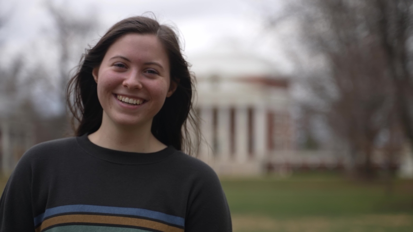 Portrait of a young teen female student at a university or college in Charlottesville, VA in front of the rotunda designed by Thomas Jefferson.