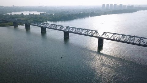 First Railway Bridge in Novosibirsk. Panorama of the city of Novosibirsk. View on the river Ob. Russia, Aerial View Hyperlapse, Point of interest