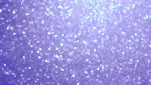 Very Peri. Color of the year 2022. Abstract background toned trendy color 2022. Sparkle lights and bokeh. Useful as New Year background or greeting card. Festive Blurred Backdrop