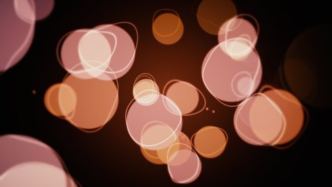 Abstract retro bokeh background with brown, orange and beige spheres and ring squiggles. This vintage style motion background animation is full HD and a seamless loop.