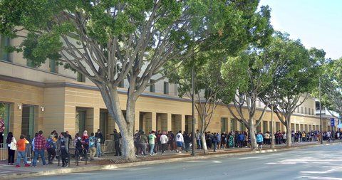 PASADENA, CALIFORNIA, USA - DECEMBER 12, 2021: Big crowd of young people waiting in line to visit Anime Pasadena and Cosplay fashion music party convention in Pasadena, California, 4K