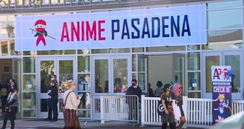 PASADENA, CALIFORNIA, USA - DECEMBER 12, 2021: Big crowd of young people waiting in line to visit Anime Pasadena and Cosplay fashion music party convention in Pasadena, California, 4K