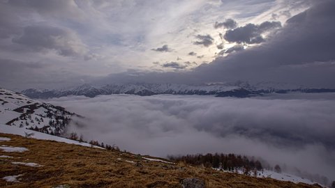 winter cloudscape timelapse,ing out over alpine valley and snowy mountains, Panoramic view
